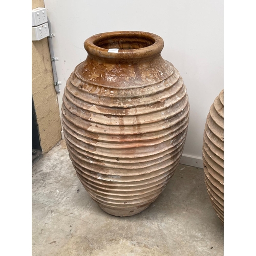1117 - Two antique large rope coil design pottery storage jars, approx 86cm H x 52cm dia and smaller (2)