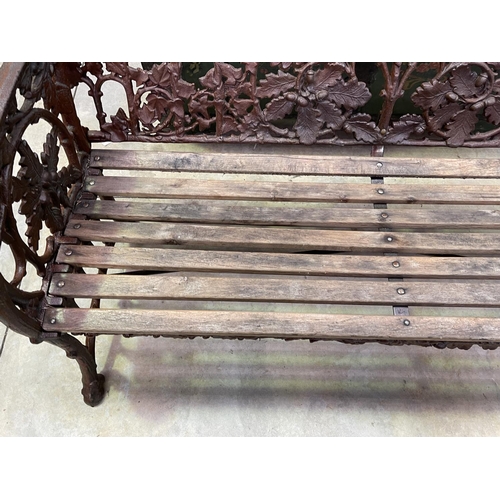 1120 - Coalbrookdale style cast iron oak leaf pattern garden bench, approx 168cm W