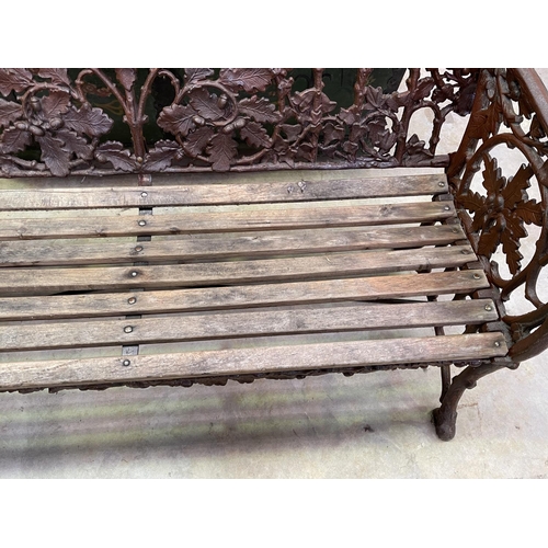 1120 - Coalbrookdale style cast iron oak leaf pattern garden bench, approx 168cm W