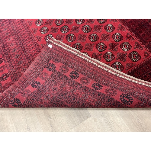 1122 - Hand knotted pure wool Afghan Bukhara carpet, approx 299cm x 204cm