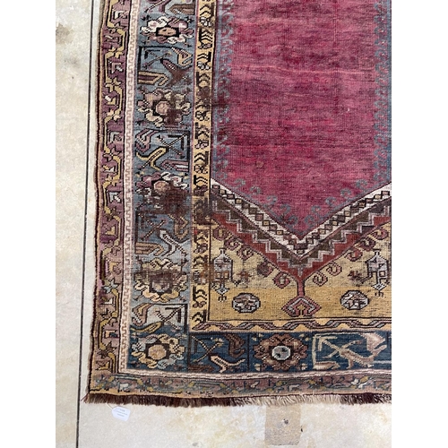 1125 - A Central Anatolian Ludik wool prayer rug with a geometric niche, approx 187cm x 107cm