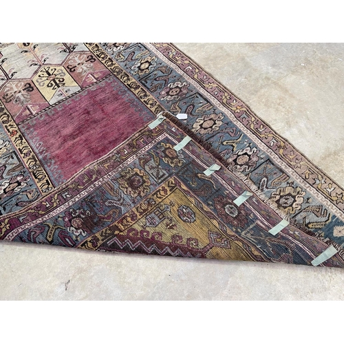 1125 - A Central Anatolian Ludik wool prayer rug with a geometric niche, approx 187cm x 107cm