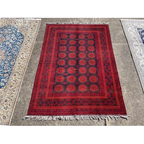 1127 - Hand knotted pure wool Afghan Kunduzi carpet, approx 290cm x 200cm