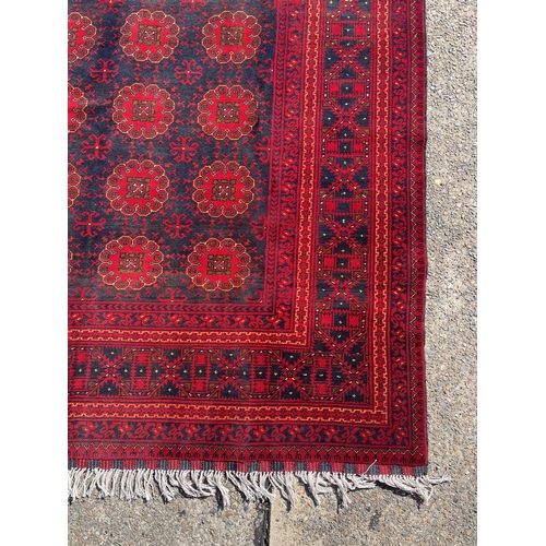 1127 - Hand knotted pure wool Afghan Kunduzi carpet, approx 290cm x 200cm