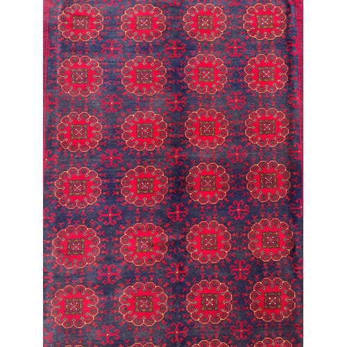 1127 - Hand knotted pure wool Afghan Kunduzi carpet, approx 290cm x 200cm