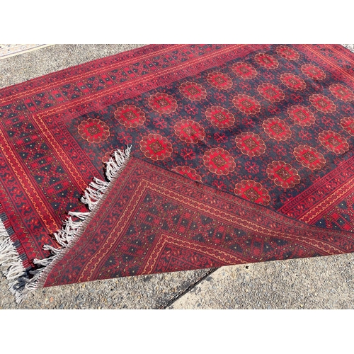 1127 - Hand knotted pure wool Afghan Kunduzi carpet, approx 290cm x 200cm