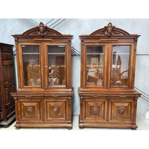 1136 - Pair of antique French walnut two height bookcases, each with a carved in high relief female mask ce... 