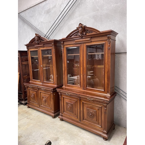 1136 - Pair of antique French walnut two height bookcases, each with a carved in high relief female mask ce... 