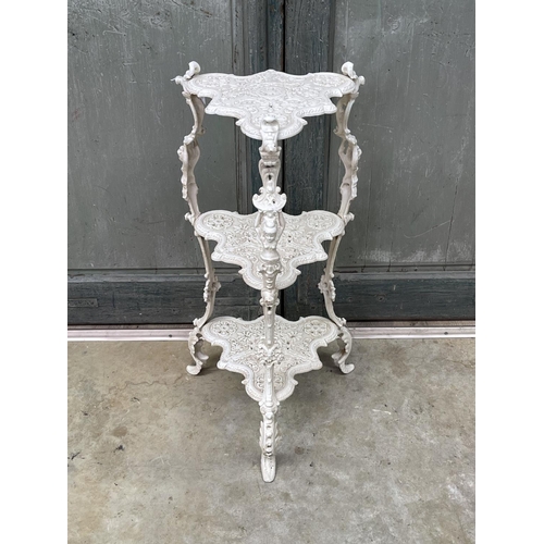 1189 - Tri legged three tier cast iron plant stand, approx 76cm H x 35cm W