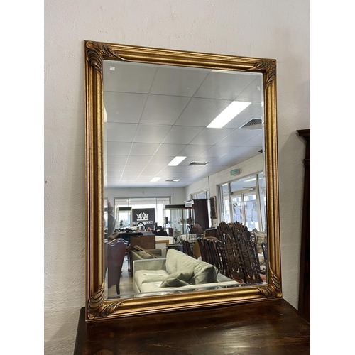 1141 - Antique style modern gilt framed bevelled glass wall mirror, approx 138cm H x 107cm W