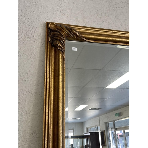 1141 - Antique style modern gilt framed bevelled glass wall mirror, approx 138cm H x 107cm W