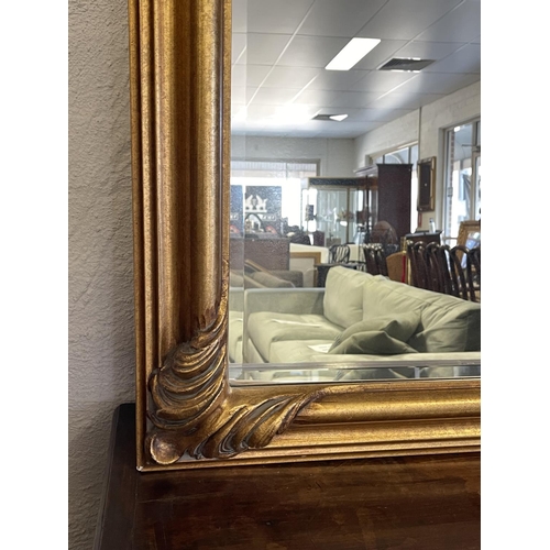 1141 - Antique style modern gilt framed bevelled glass wall mirror, approx 138cm H x 107cm W