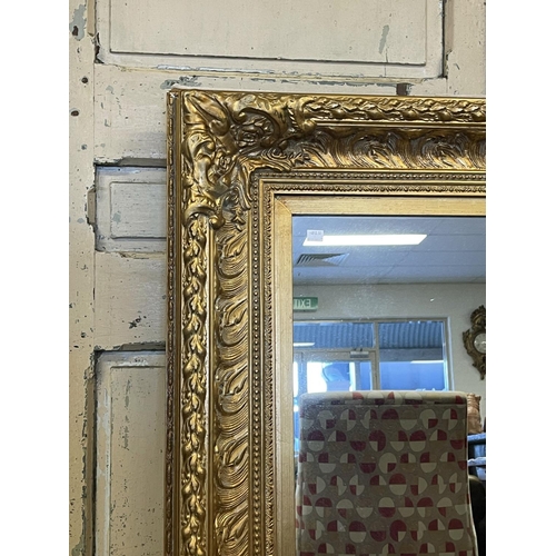 1160 - Decorative gilt surround wall mirror, approx 123cm x 92cm