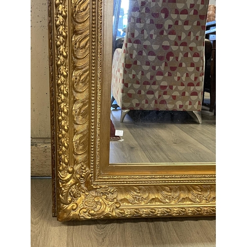 1160 - Decorative gilt surround wall mirror, approx 123cm x 92cm