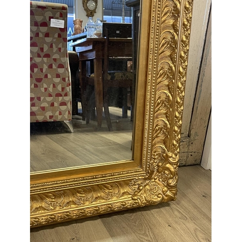 1160 - Decorative gilt surround wall mirror, approx 123cm x 92cm