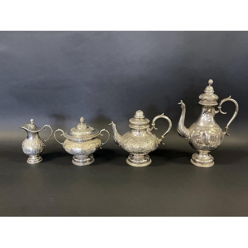 1163 - Antique sterling silver four piece tea & coffee service, each of baluster shape, and repousse worked... 