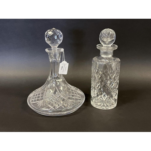 1165 - Good quality cut crystal ships decanter along with a cylinder example, each approx 26cm H (2)