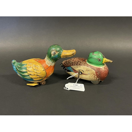 1187 - Two vintage tin clock work and friction drive ducks, one made in Japan and the other. Made in West G... 