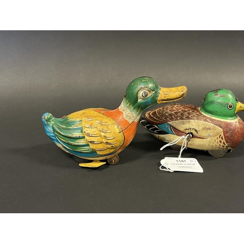 1187 - Two vintage tin clock work and friction drive ducks, one made in Japan and the other. Made in West G... 