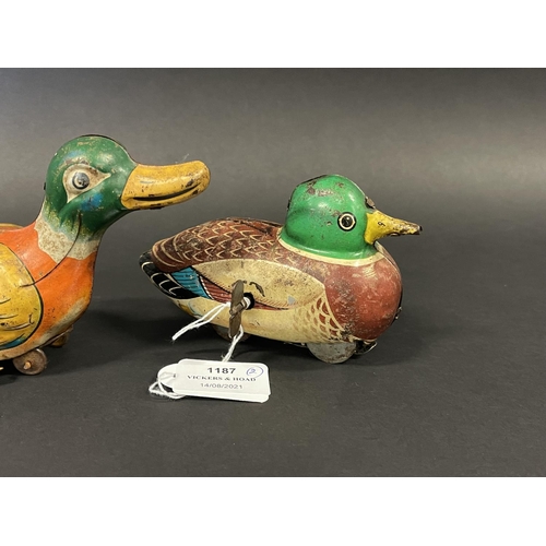 1187 - Two vintage tin clock work and friction drive ducks, one made in Japan and the other. Made in West G... 