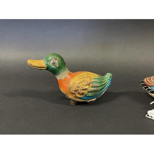 1187 - Two vintage tin clock work and friction drive ducks, one made in Japan and the other. Made in West G... 