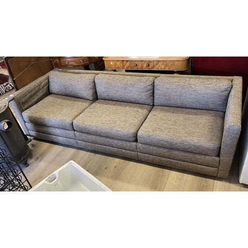 1195 - Modern charcoal coloured upholstered four seater couch, approx 230cm W