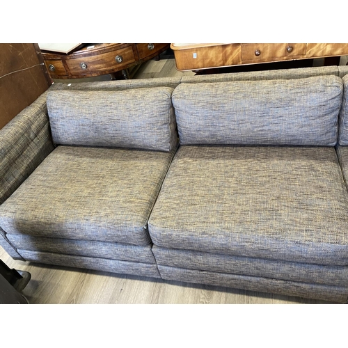 1195 - Modern charcoal coloured upholstered four seater couch, approx 230cm W