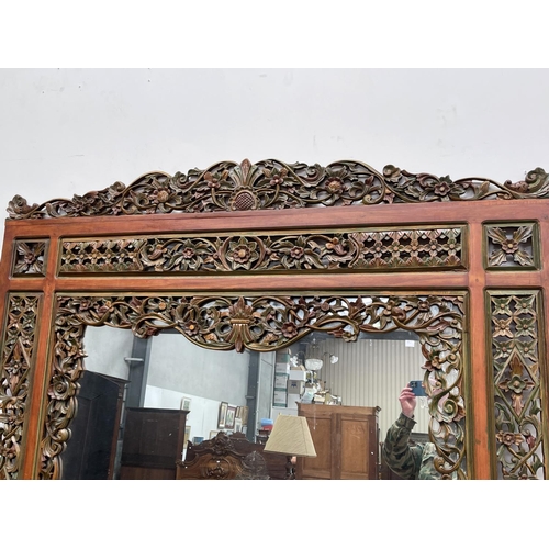 1197 - Large Balinese carved and pierced wood mirror, approx 156cm H x 176cm W