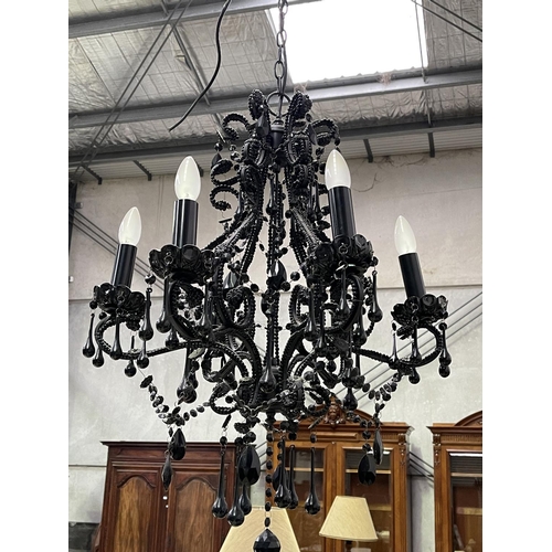 1207 - Black glass six light chandelier, with applied tear drops and chains, approx 77cm H