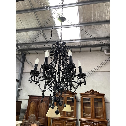 1207 - Black glass six light chandelier, with applied tear drops and chains, approx 77cm H