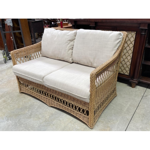 1208 - Modern cane two seater settee, approx 125cm W (clean)