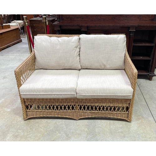 1208 - Modern cane two seater settee, approx 125cm W (clean)