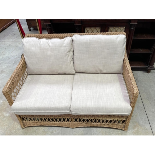 1208 - Modern cane two seater settee, approx 125cm W (clean)