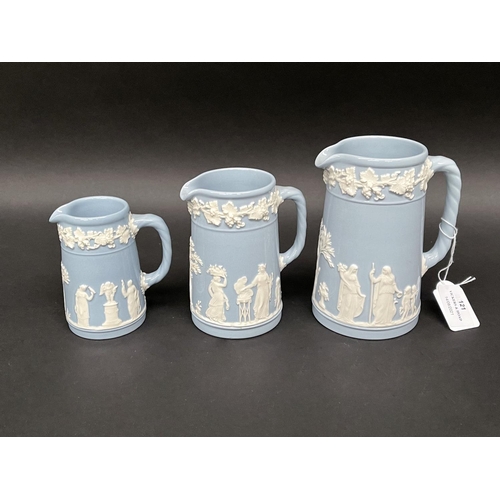 121 - Three Wedgwood Blue jasper graduated jugs, approx 14.5cm H to 10cm H (3)