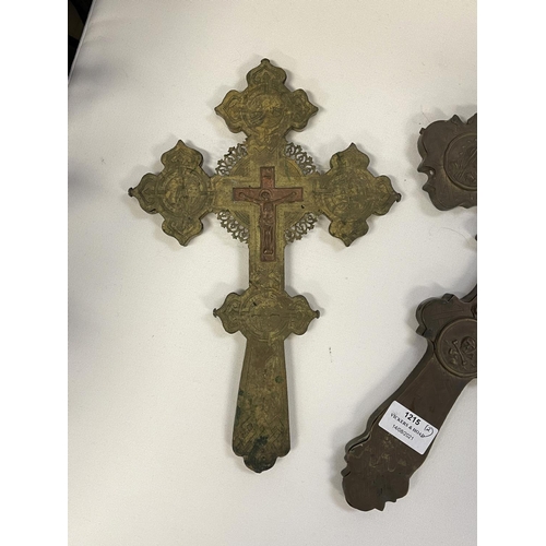 1215 - Two antique brass crosses, approx 38cm x 22cm & smaller (2)