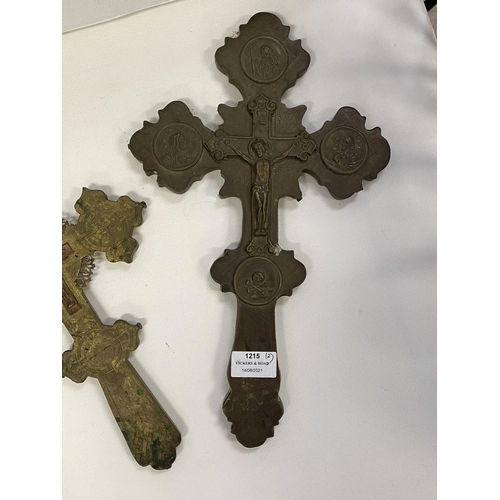 1215 - Two antique brass crosses, approx 38cm x 22cm & smaller (2)