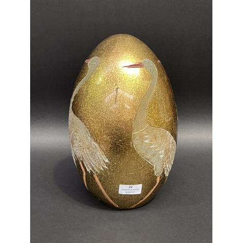 32 - Decorative egg shaped ornament, decorated with incised waterbirds, approx 32cm H