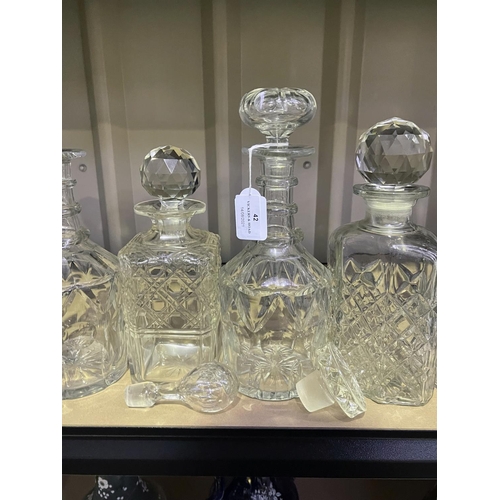42 - Assortment of glass and cut crystal decanters and loose stoppers decanters, approx 26cm and smaller ... 