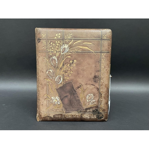 76 - Antique leather bound embossed photo album no clasp, approx 30cm x 24cm x 7cm