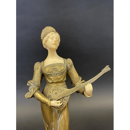 1011 - Bronze and ivory figure of a female lute player in Medieval dress, signed to base, Collalino, approx... 