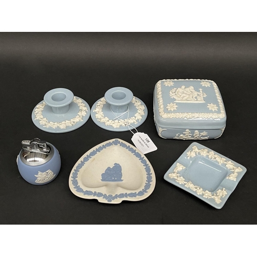 135 - Wedgwood blue jasper cigarette lighter, cigarette pot, ashtrays and candle holder, approx 5cm H and ... 