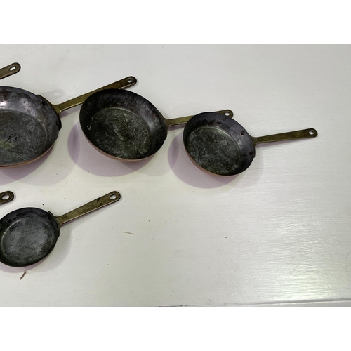 177 - Set of 7 graduated copper frypans, approx 23.5cm Dia and smaller (7)