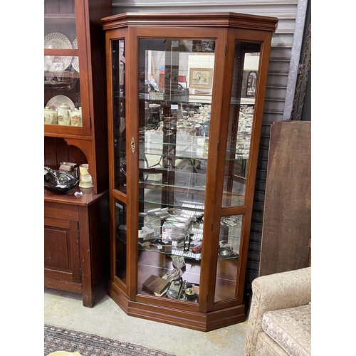 181 - Modern canted side display cabinet with light, approx 183cm H x 98cm W