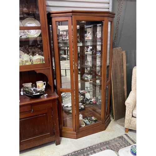 181 - Modern canted side display cabinet with light, approx 183cm H x 98cm W