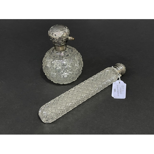 185 - Two silver top perfumes, approx 22.5cm and smaller (2)