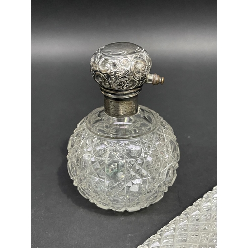 185 - Two silver top perfumes, approx 22.5cm and smaller (2)