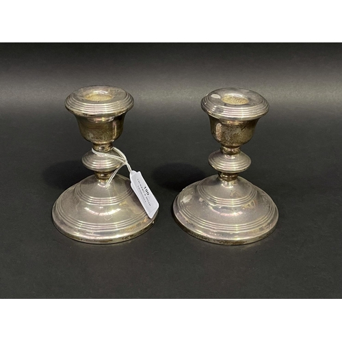 190 - Pair of sterling silver squat weighted candlesticks, hallmarked for Birmingham?, approx 12cm H each ... 