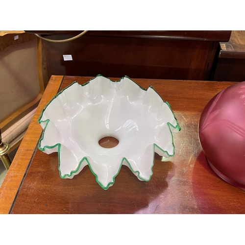 234 - Two milk glass light shades and a maroon example, approx 20cm H and smaller (3)