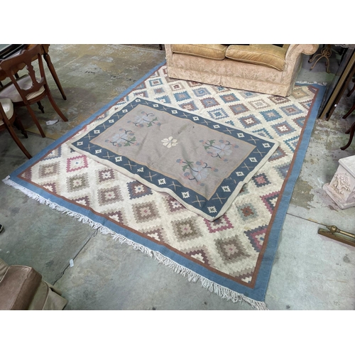 279 - Two wool rugs, soft pastel tones, approx 290cm x 238cm and 194cm x 124cm (2)