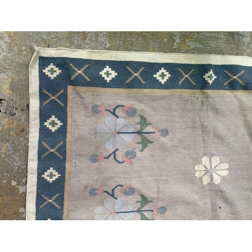 279 - Two wool rugs, soft pastel tones, approx 290cm x 238cm and 194cm x 124cm (2)